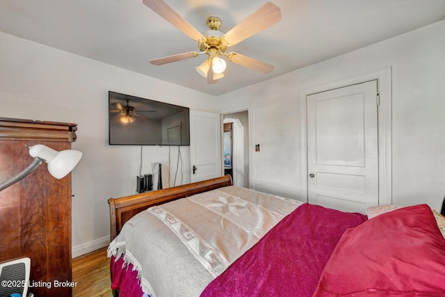 bedroom featuring ceiling fan and light hardwood / wood-style floors