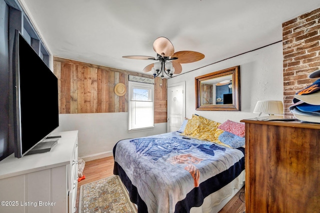 bedroom featuring light wood-type flooring and ceiling fan