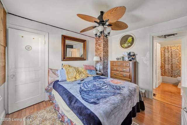 bedroom featuring ensuite bathroom, ceiling fan, and light hardwood / wood-style floors