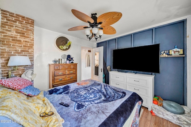 bedroom with hardwood / wood-style flooring and ceiling fan