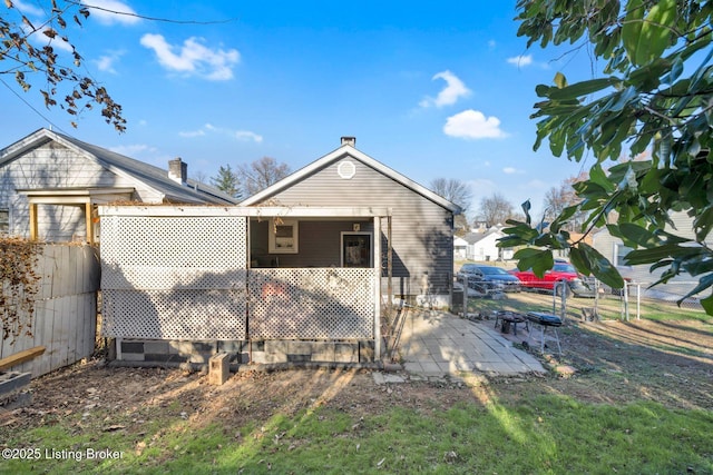 back of property featuring a patio