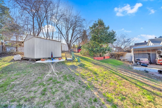 view of yard with a storage unit