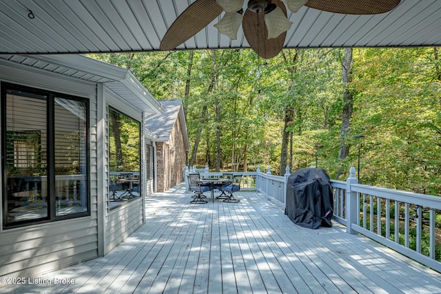 deck featuring grilling area and ceiling fan