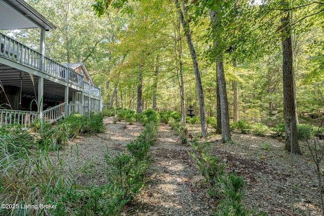 view of yard with a wooden deck