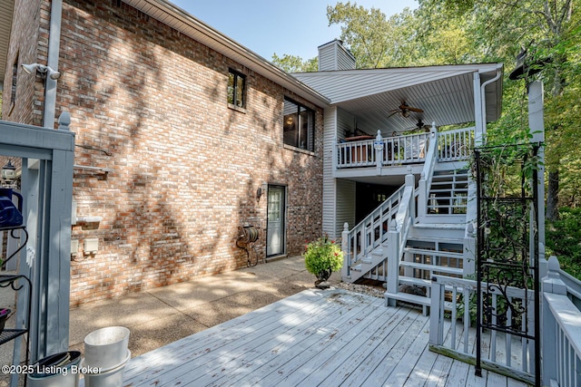 wooden terrace featuring ceiling fan