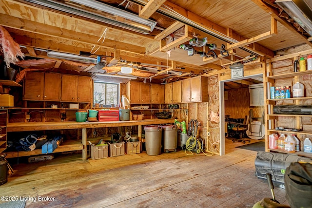 interior space featuring a workshop area and light hardwood / wood-style floors