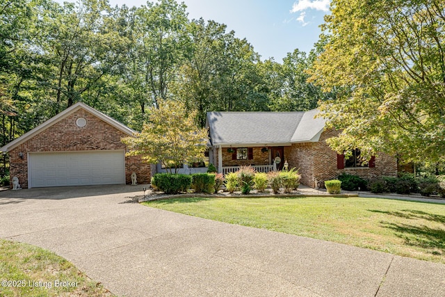 view of front of home featuring a front yard, a porch, and a garage