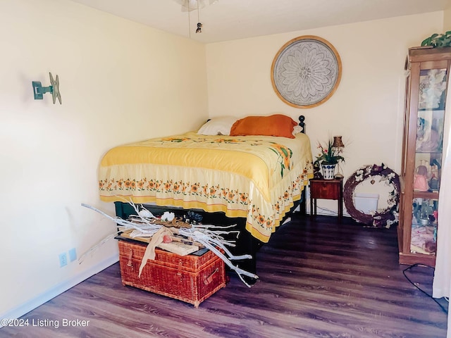 bedroom featuring dark hardwood / wood-style floors