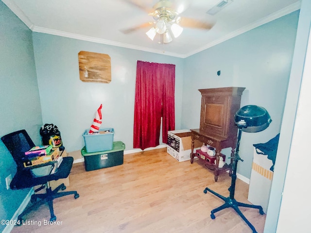 home office featuring hardwood / wood-style floors, ceiling fan, and ornamental molding