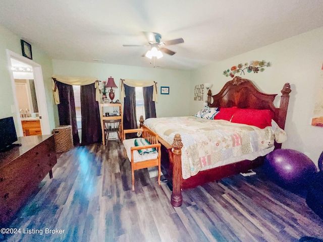 bedroom with ceiling fan, dark hardwood / wood-style floors, and connected bathroom