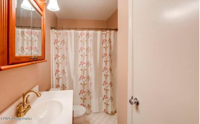 bathroom featuring walk in shower, sink, and toilet