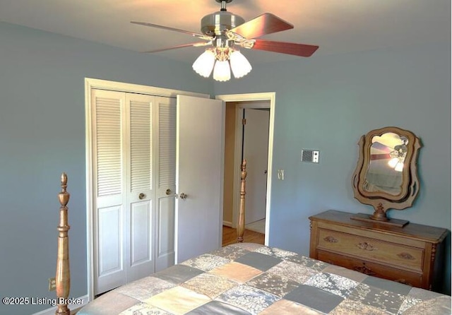 bedroom featuring ceiling fan and a closet