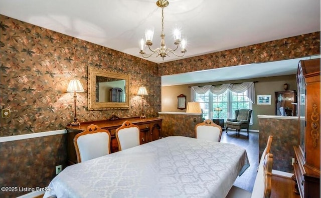 dining room featuring a notable chandelier and dark hardwood / wood-style flooring