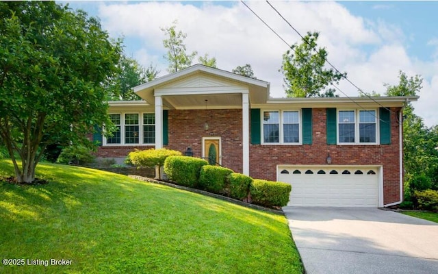 view of front of property featuring a garage and a front yard