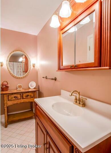 bathroom with tile patterned flooring and vanity