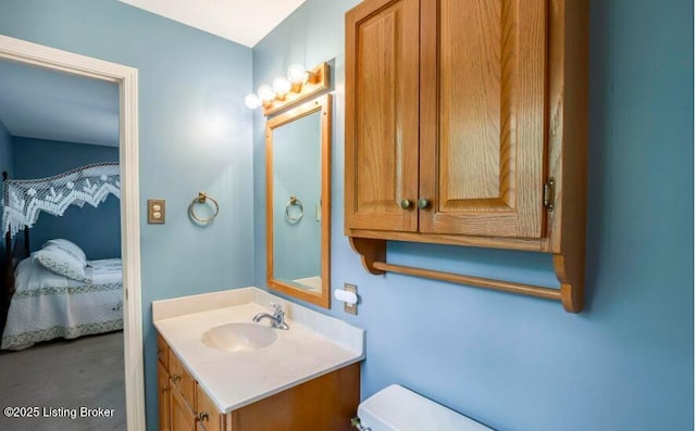 bathroom with vanity and toilet