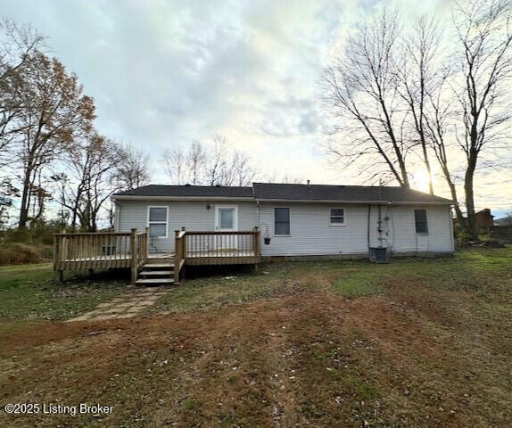 rear view of house featuring a deck