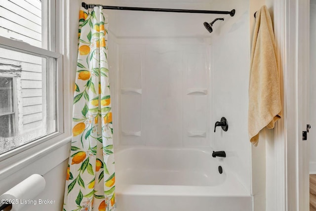 bathroom with shower / bathtub combination with curtain