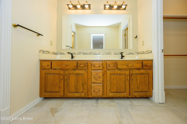 bathroom featuring backsplash and vanity