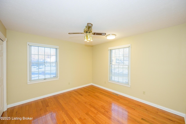 spare room with ceiling fan and light hardwood / wood-style flooring