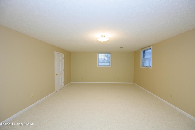 basement with a textured ceiling and carpet floors