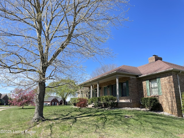 view of property exterior with a yard