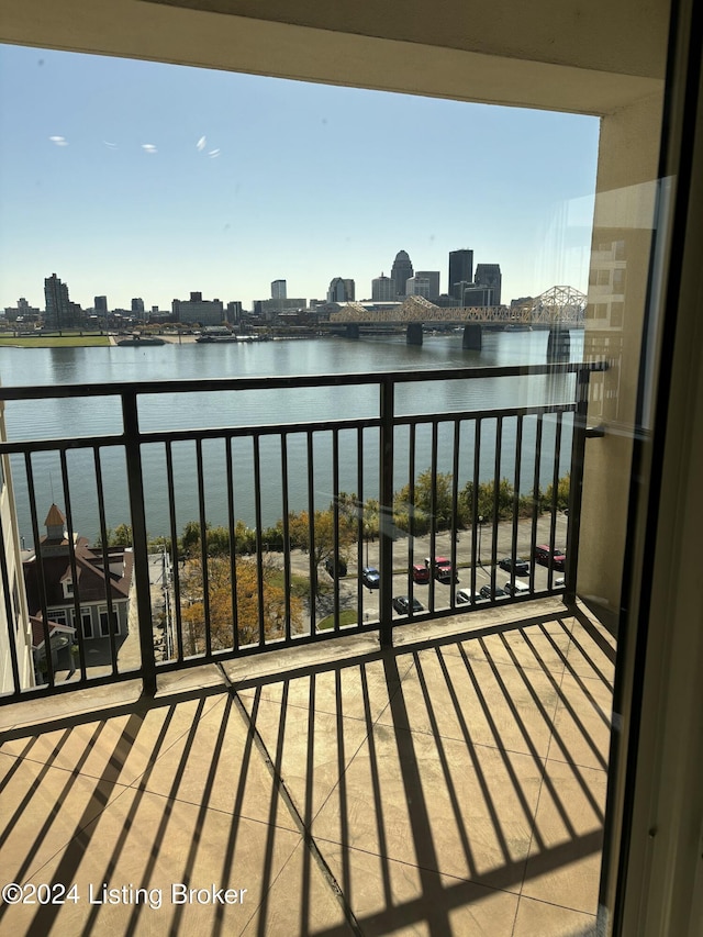 balcony featuring a water view