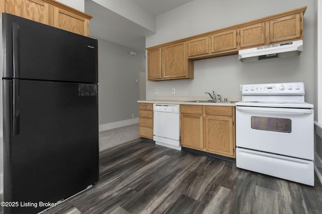 kitchen with white appliances, sink, and dark wood-type flooring