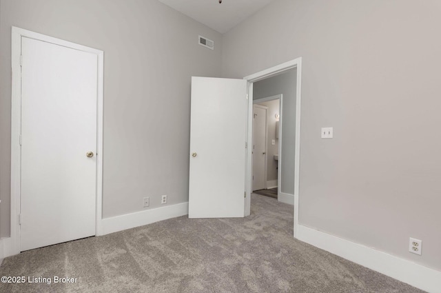 unfurnished bedroom featuring light colored carpet