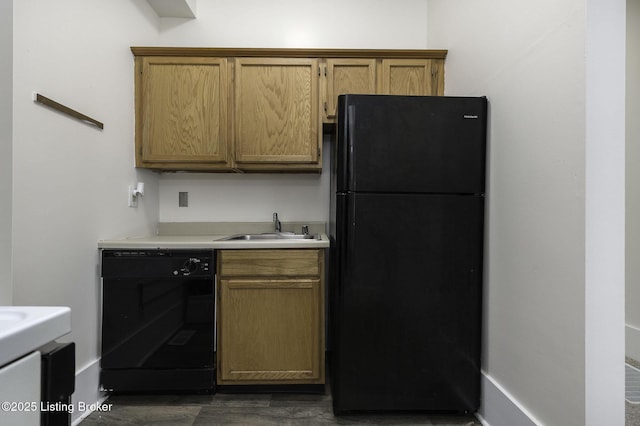 kitchen featuring sink and black appliances