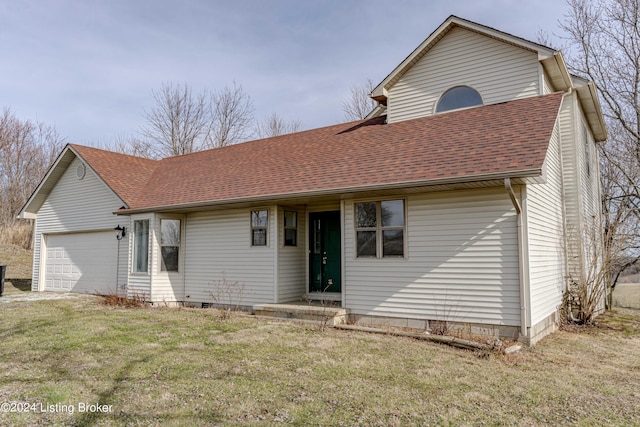 view of front facade with a front yard and a garage