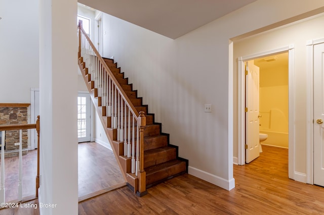 stairway featuring hardwood / wood-style floors