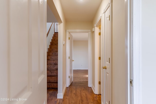 corridor with wood-type flooring