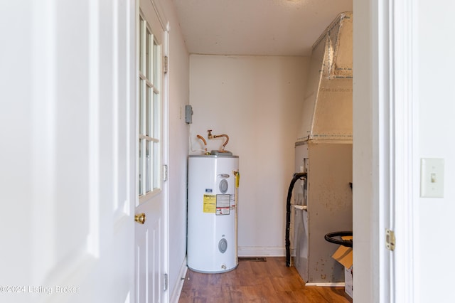 utility room with electric water heater