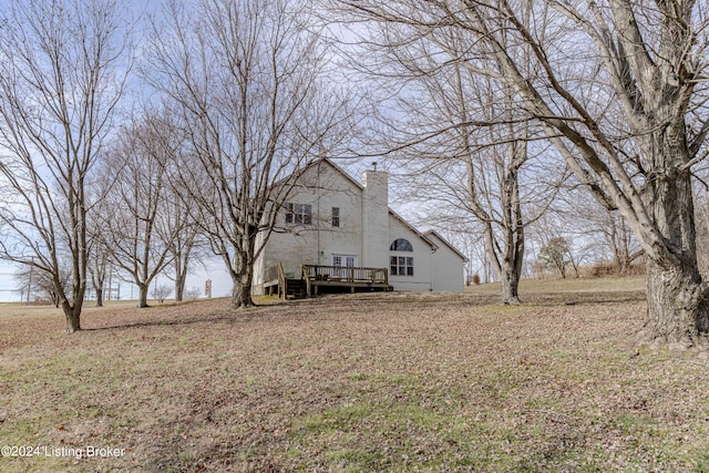 view of yard featuring a wooden deck