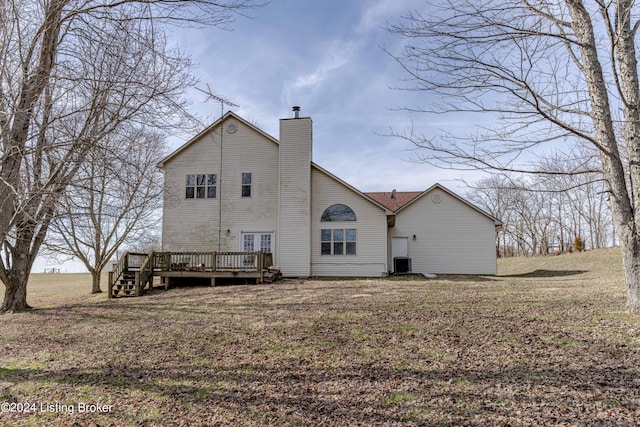 rear view of property with a deck and central air condition unit