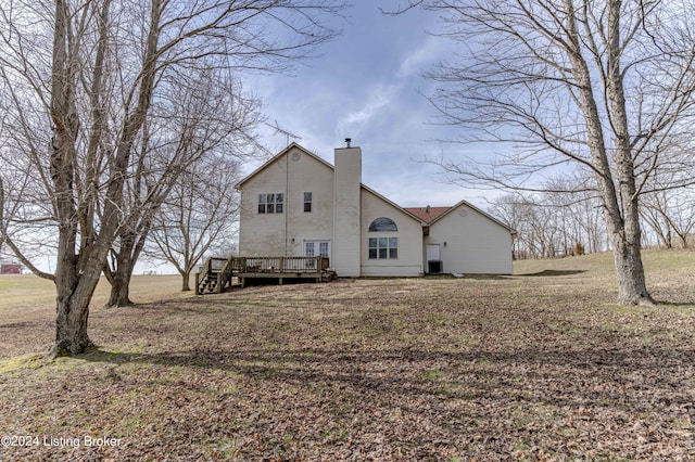 back of property with cooling unit and a deck