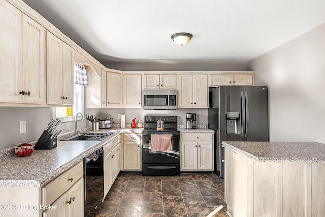 kitchen with sink and black appliances