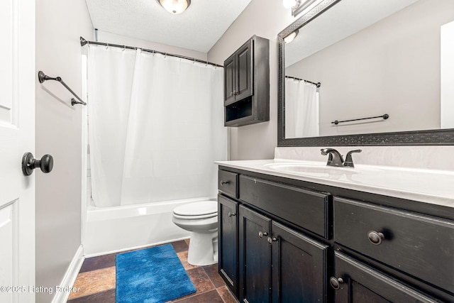 full bathroom with toilet, vanity, shower / bath combo, and a textured ceiling