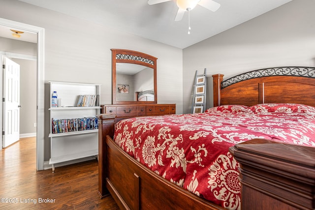 bedroom with ceiling fan and dark hardwood / wood-style floors