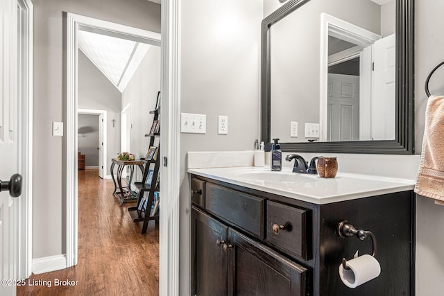 bathroom with vanity and hardwood / wood-style floors