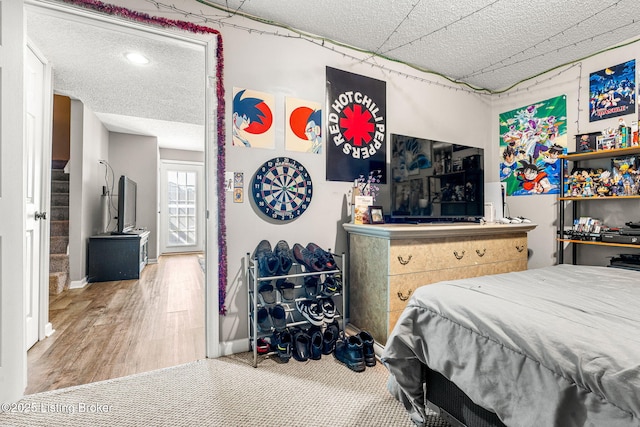 bedroom with hardwood / wood-style flooring