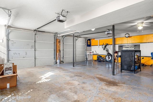 garage with ceiling fan and a garage door opener