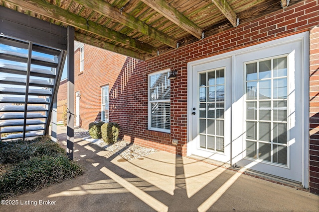 doorway to property with a patio