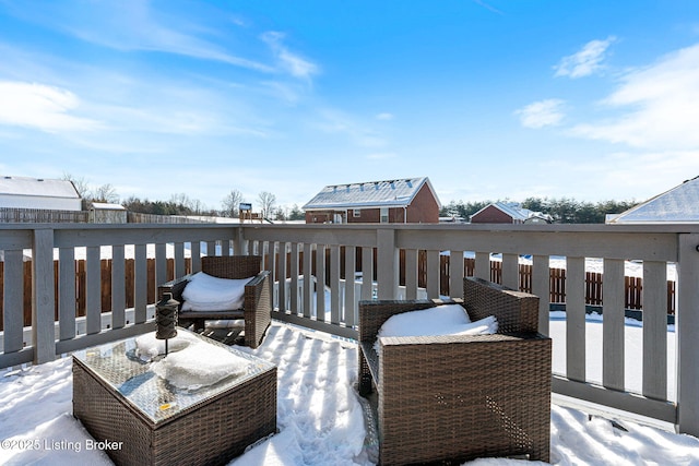 view of snow covered deck