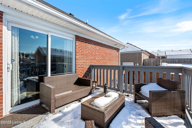 view of snow covered deck