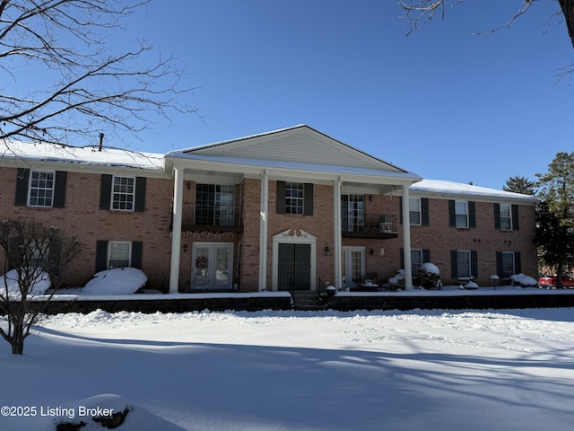 greek revival inspired property with french doors