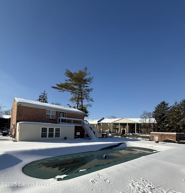 view of snow covered pool