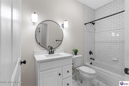 full bathroom with vanity, toilet, and tiled shower / bath