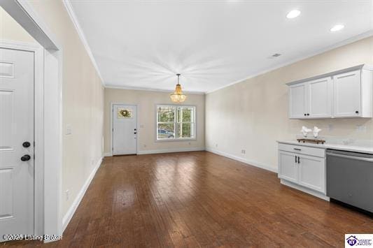 kitchen featuring crown molding, dishwasher, dark hardwood / wood-style floors, white cabinetry, and hanging light fixtures